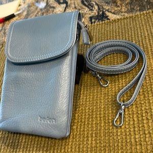 Small leather crossover. Great for store runs.  No need to haul your purse!